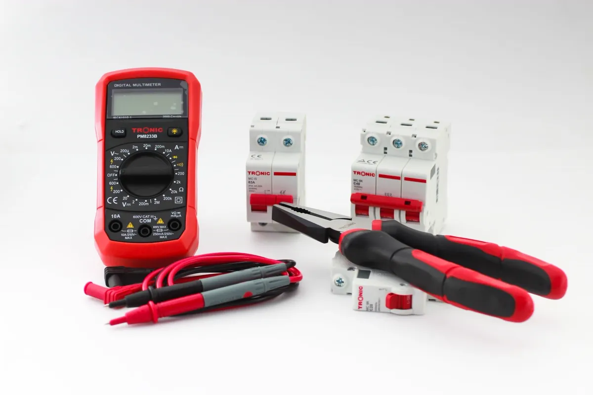 Electrical tools and wiring on the bench during an off-grid power install