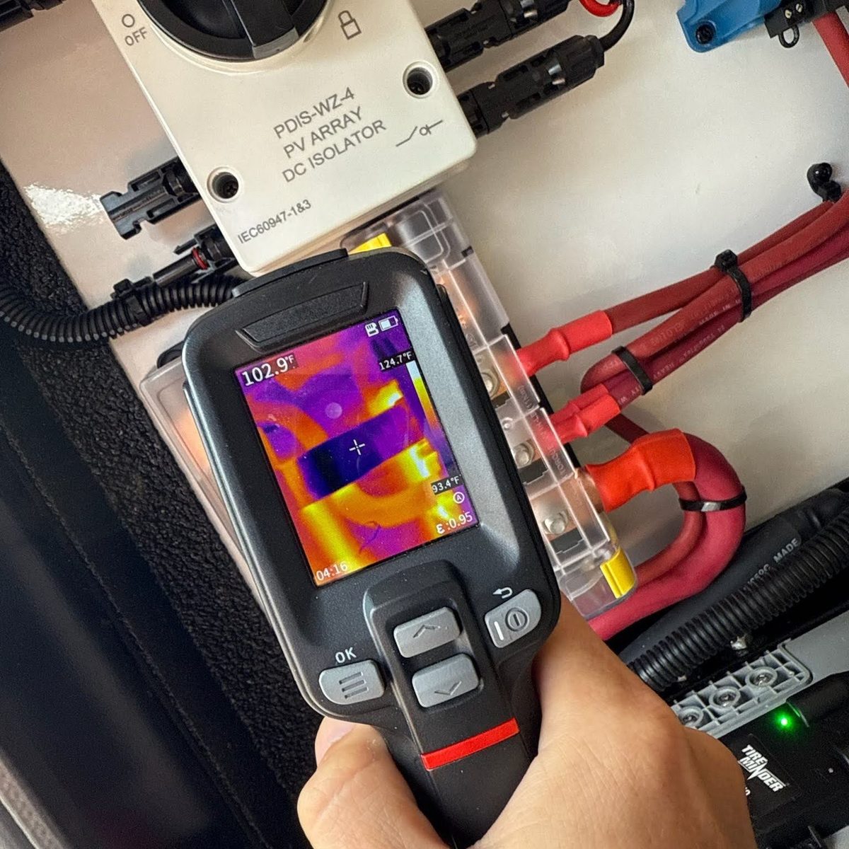 Thermal imaging check on an RV solar DC isolator and battery terminals during a Stream RV electrical inspection